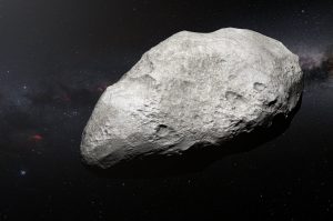 Esta ilustración muestra al asteroide exiliado 2004 EW95, el primer asteroide rico en carbono confirmado en el cinturón de Kuiper y una reliquia del Sistema Solar primordial. ESO/M. Kornmesser.